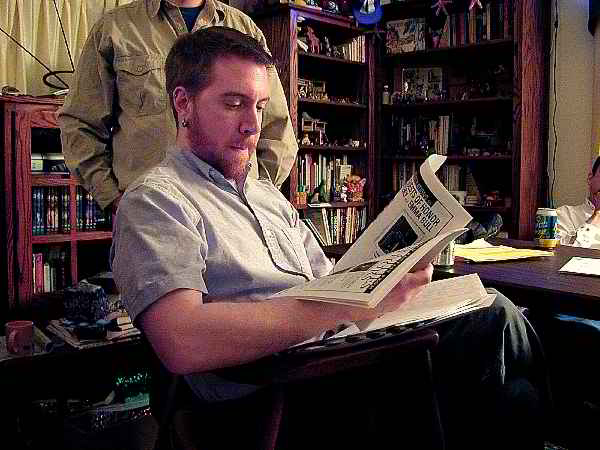 Andrew reviewing the program book proof