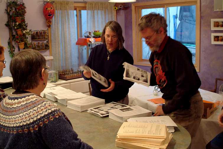 Mia and Glenn McDavid setting up program book