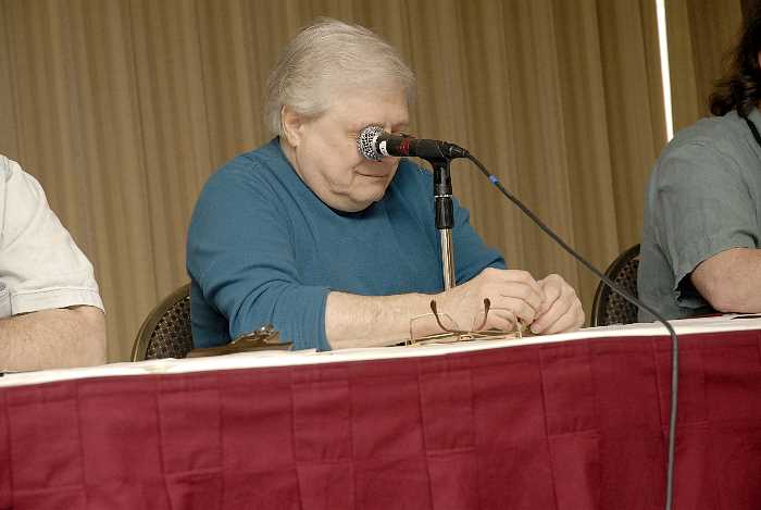 Harlan attempts to ram microphone through eye socket