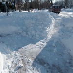 Sidewalks and cut through snowbank to street