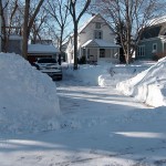 Driveway and snow piles at the corners