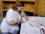 Pamela signs the large get-well card