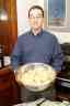 Eric displays the apples for two thanksgiving pies