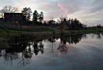 Language and Dining Center and Goodsell Observatory across Lyman Lakes at dusk.